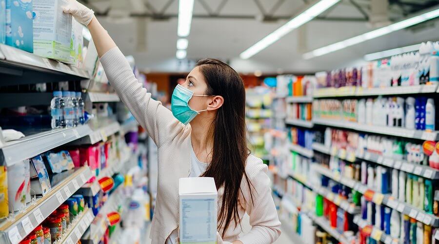 Woman Wearing Mask And Gloves Buying Baby Formula Due To Covid19