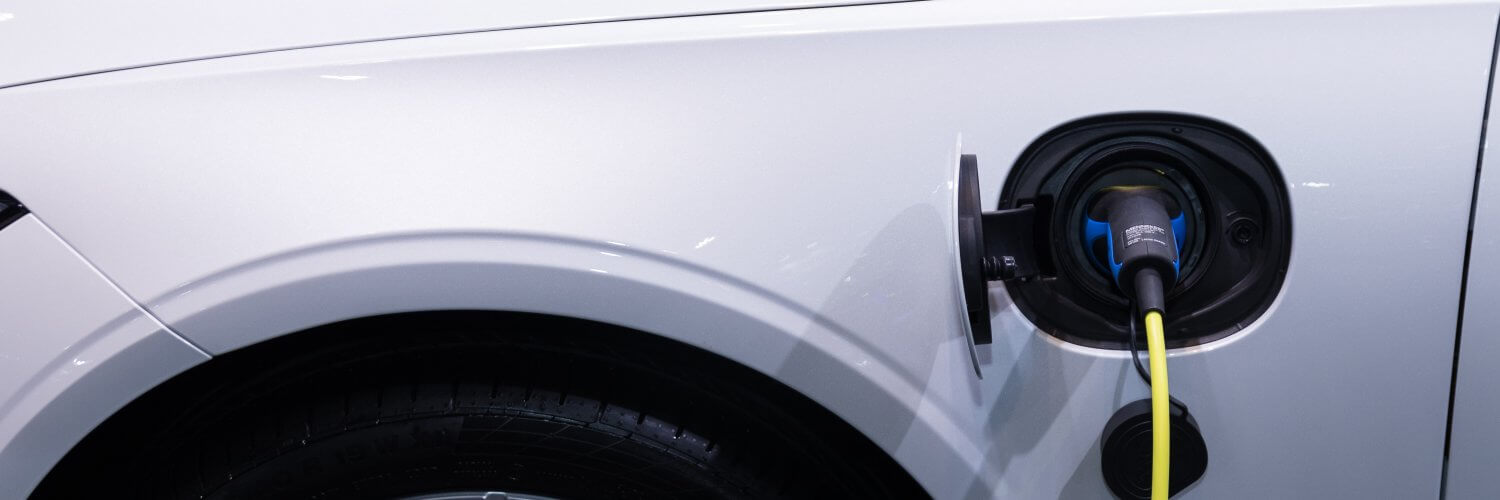 an electric car with charging plug attached