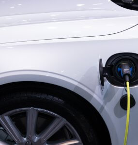 an electric car with charging plug attached