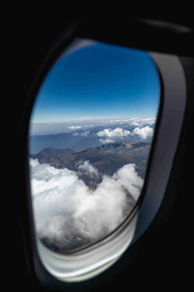 plane in flight showing window view